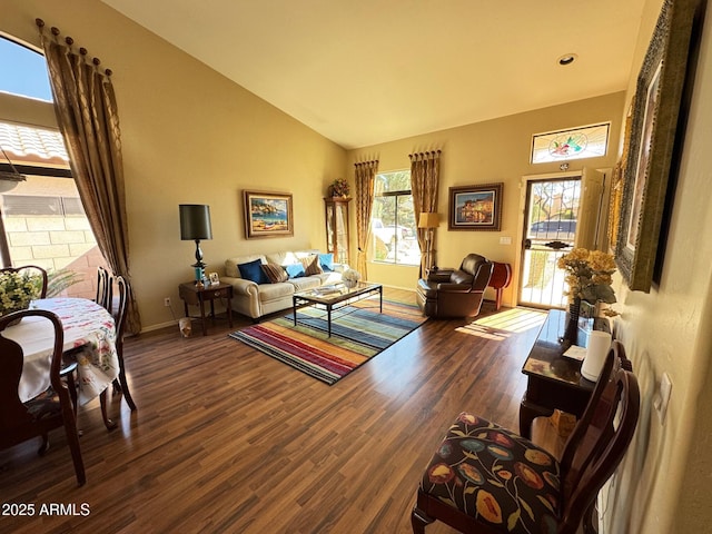 living room with lofted ceiling and dark hardwood / wood-style floors