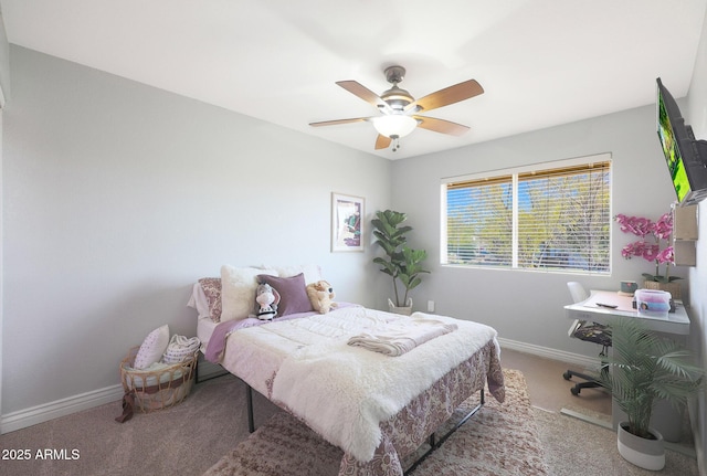 bedroom featuring ceiling fan and carpet