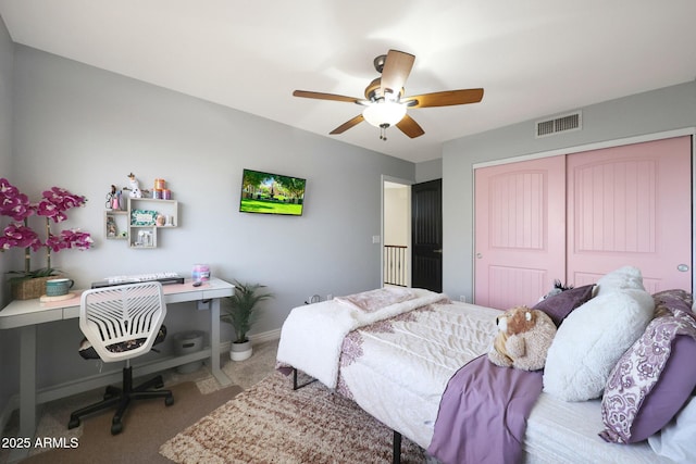 bedroom featuring carpet flooring, ceiling fan, and a closet