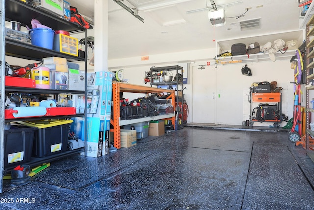 garage featuring a garage door opener and a workshop area