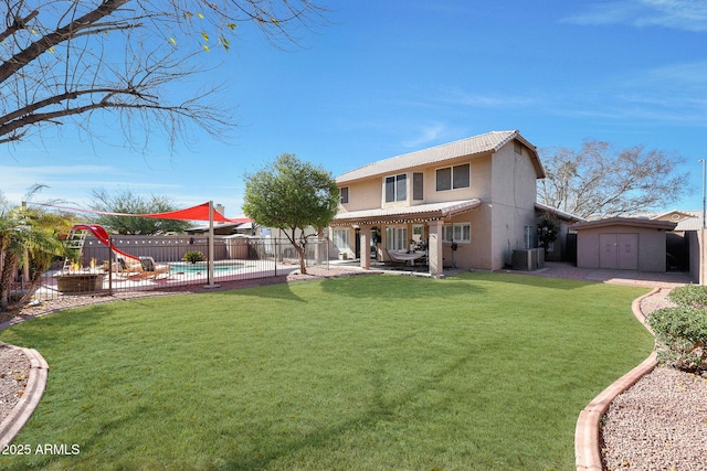 back of property featuring a storage shed, a fenced in pool, a lawn, a pergola, and central AC