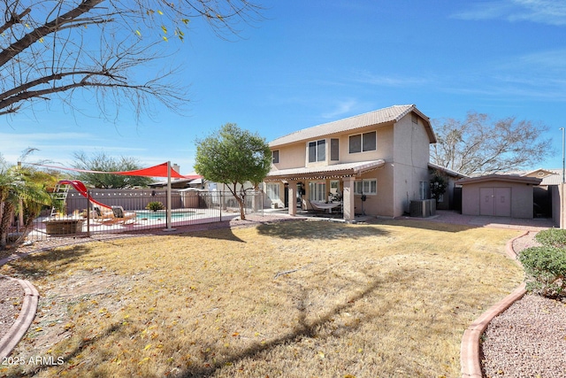 rear view of house featuring a storage shed, a fenced in pool, a pergola, central AC unit, and a playground