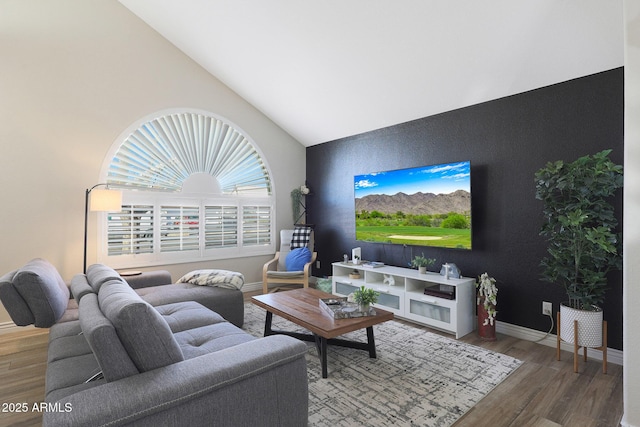 living room featuring wood-type flooring and lofted ceiling