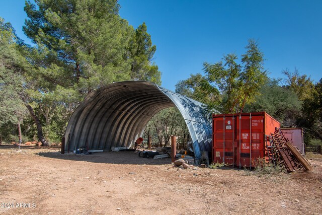 view of parking / parking lot with a carport