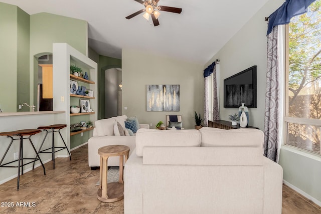 3055 N Red Mtn Unit 77, Mesa, AZ 85207 - living area with ceiling fan, baseboards, arched walkways, and vaulted ceiling