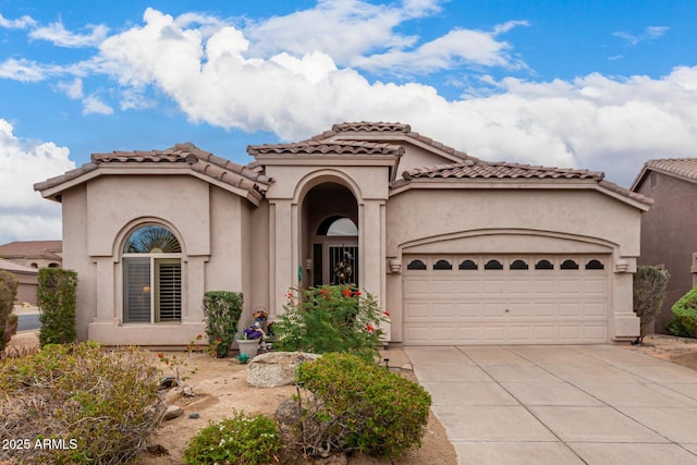 3055 N Red Mtn Unit 77, Mesa, AZ 85207 - mediterranean / spanish house with an attached garage, concrete driveway, stucco siding, and a tiled roof