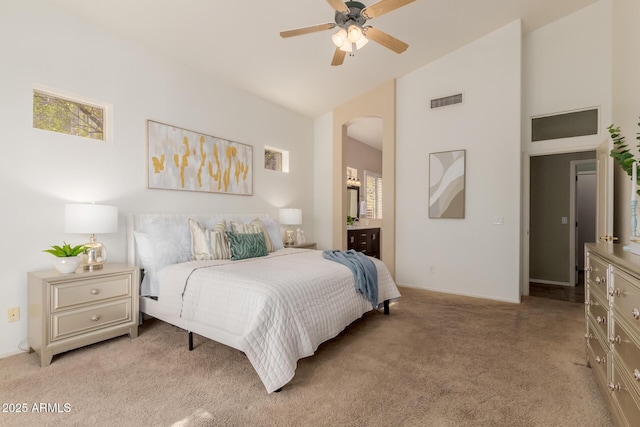 3055 N Red Mtn Unit 77, Mesa, AZ 85207 - bedroom with light carpet, high vaulted ceiling, arched walkways, connected bathroom, and baseboards