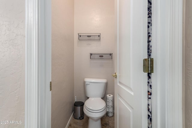 3055 N Red Mtn Unit 77, Mesa, AZ 85207 - bathroom with toilet and baseboards