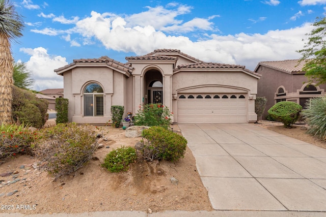 3055 N Red Mtn Unit 77, Mesa, AZ 85207 - mediterranean / spanish house with a garage, stucco siding, driveway, and a tile roof