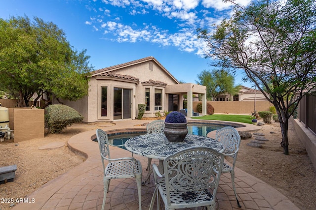 3055 N Red Mtn Unit 77, Mesa, AZ 85207 - back of property featuring a patio area, stucco siding, a tiled roof, and a fenced backyard