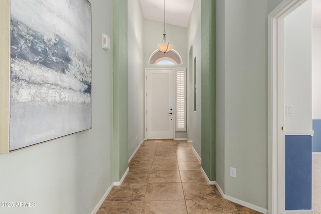 3055 N Red Mtn Unit 77, Mesa, AZ 85207 - corridor featuring baseboards, tile patterned floors, and a high ceiling