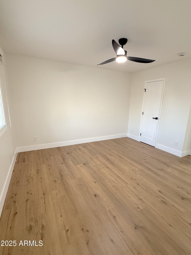 spare room with ceiling fan and light hardwood / wood-style flooring