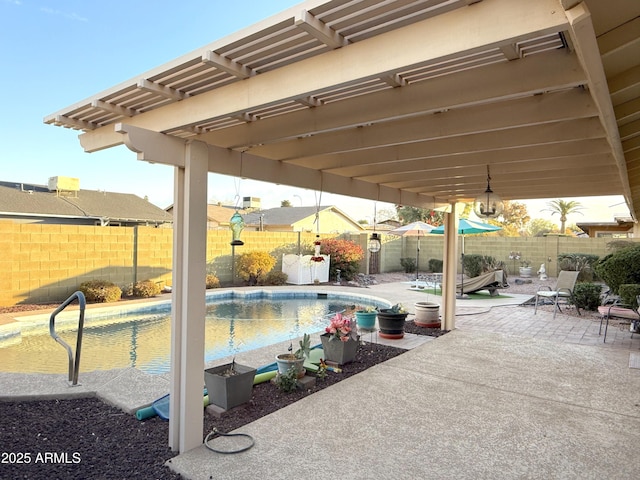 view of swimming pool with a pergola and a patio