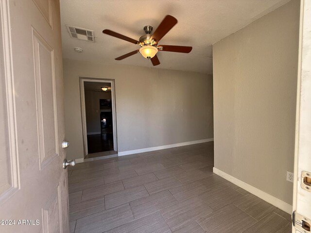 spare room with ceiling fan