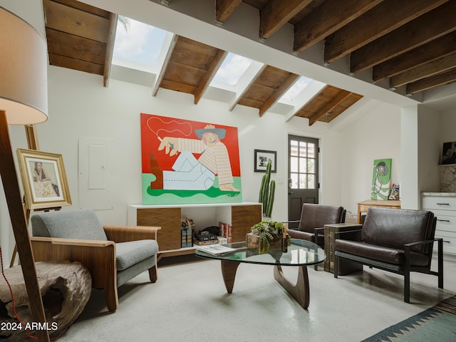 sitting room featuring lofted ceiling with skylight