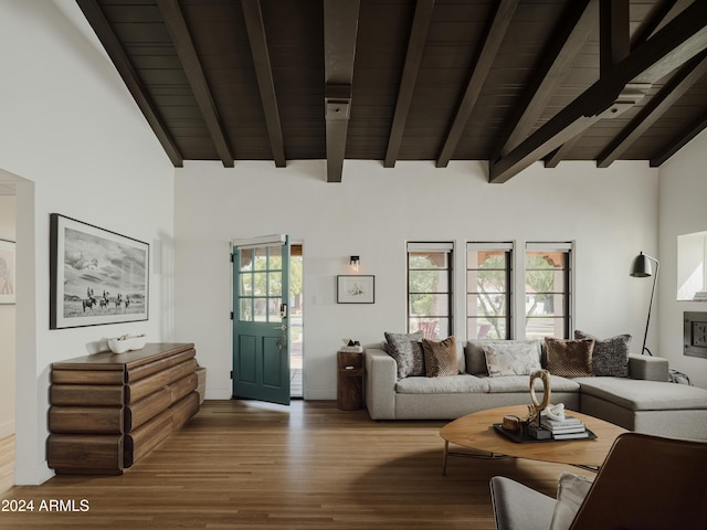 living room featuring beam ceiling, hardwood / wood-style flooring, high vaulted ceiling, and wooden ceiling