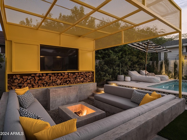 view of patio featuring a fenced in pool and an outdoor living space with a fire pit