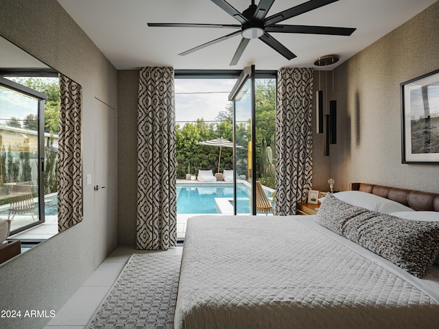 bedroom featuring access to exterior, expansive windows, ceiling fan, and light tile patterned flooring