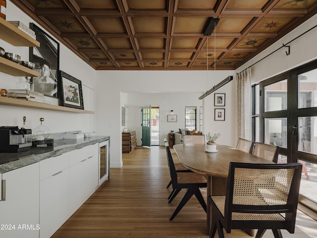 dining room featuring coffered ceiling, wine cooler, dark wood-type flooring, and french doors