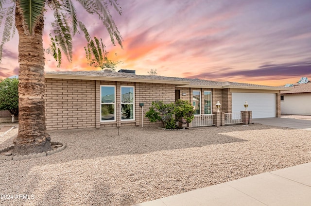 single story home featuring a garage