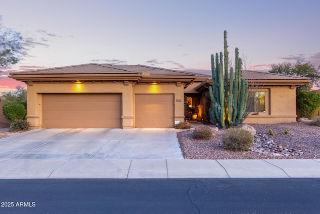 prairie-style home featuring a garage