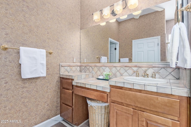 bathroom featuring vanity and decorative backsplash