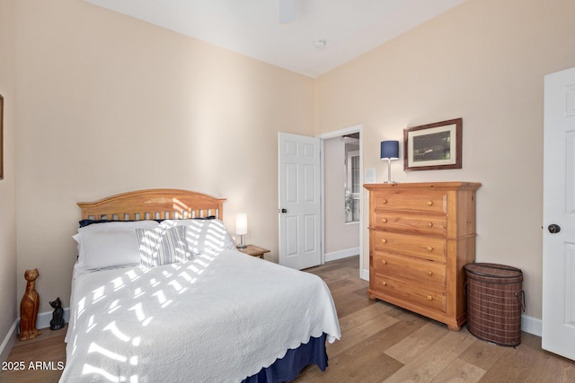 bedroom with hardwood / wood-style flooring and ceiling fan