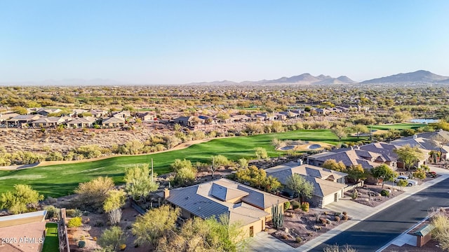 birds eye view of property with a mountain view