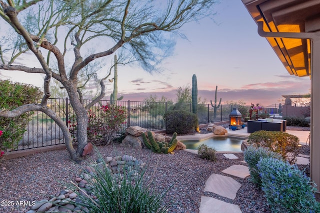 yard at dusk with an outdoor hangout area