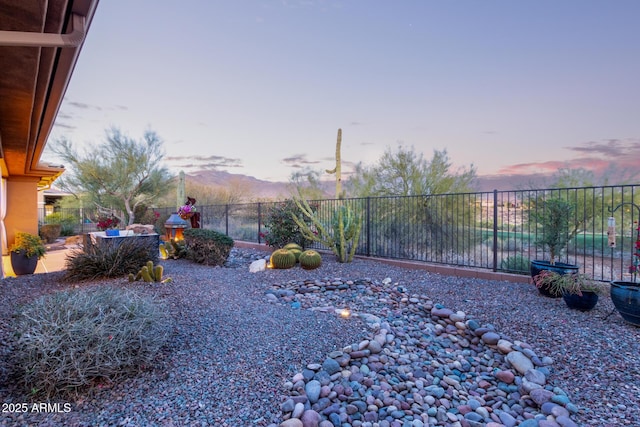 view of yard at dusk