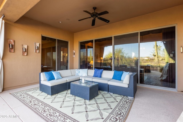 view of patio / terrace with ceiling fan and an outdoor living space