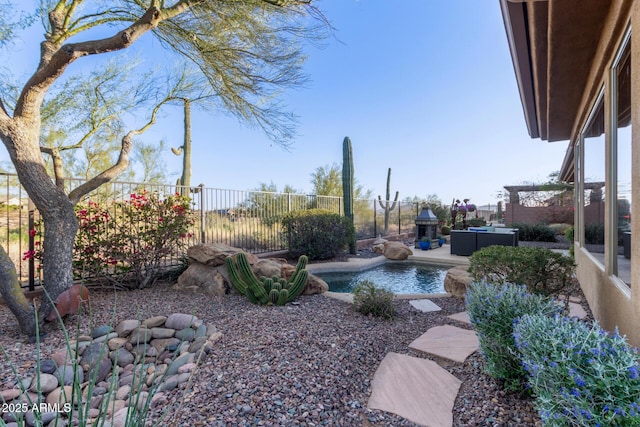 view of yard featuring a fenced in pool, outdoor lounge area, and a patio area