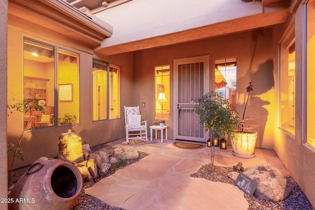 doorway to property featuring a patio