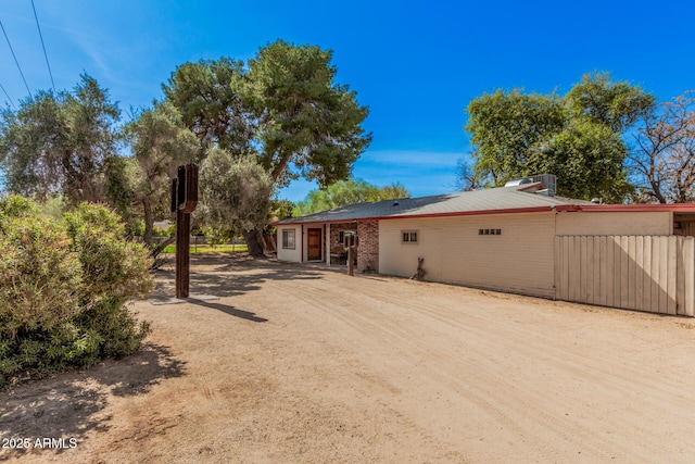 view of front of property featuring fence