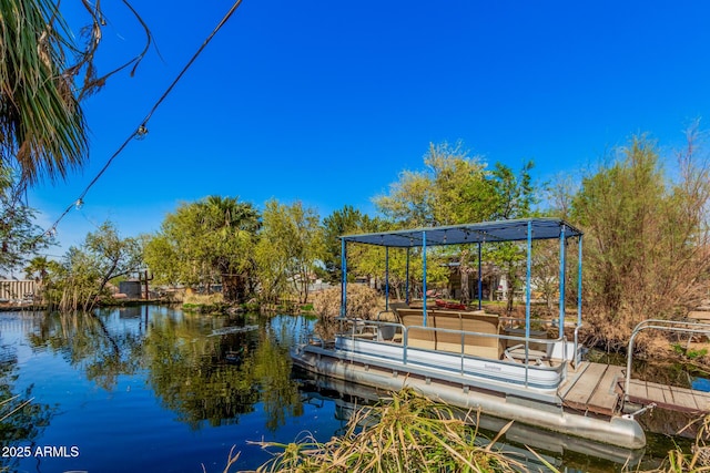 dock area featuring a water view and a pergola