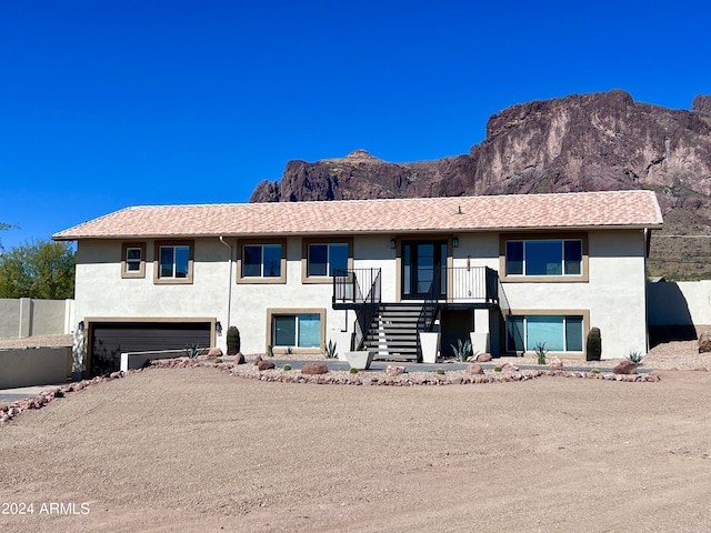 view of front of home featuring a garage and a mountain view