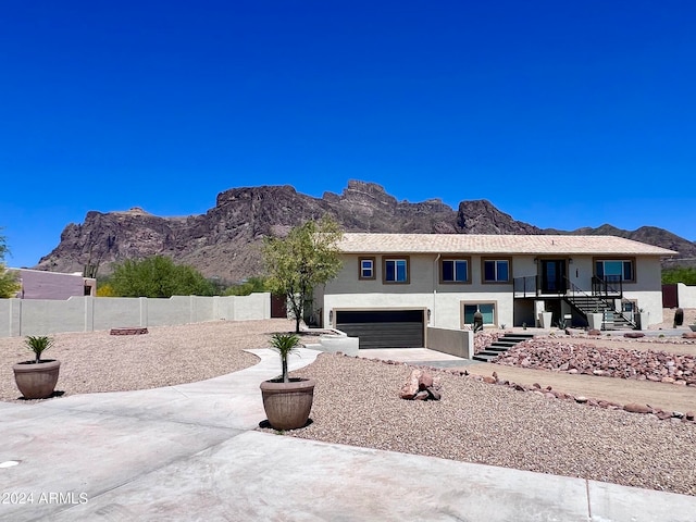 exterior space with a garage and a mountain view