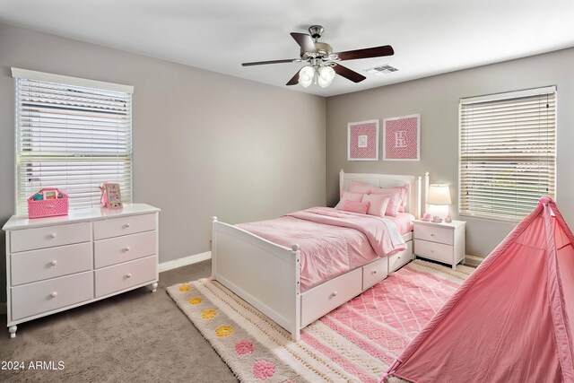 bedroom featuring ceiling fan, baseboards, visible vents, and light carpet