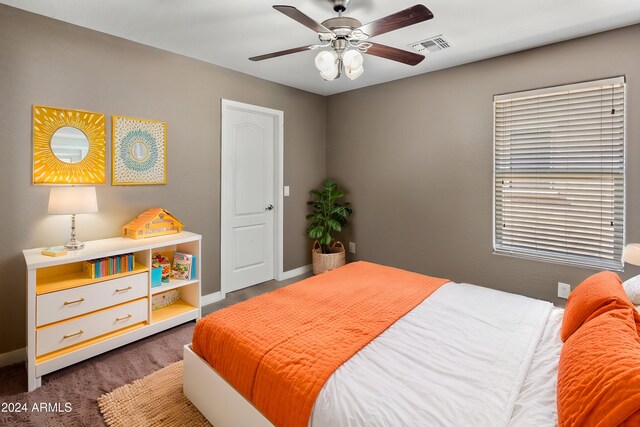 bedroom featuring visible vents, baseboards, and ceiling fan