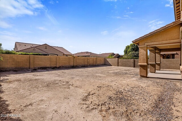 view of yard featuring a patio and a fenced backyard