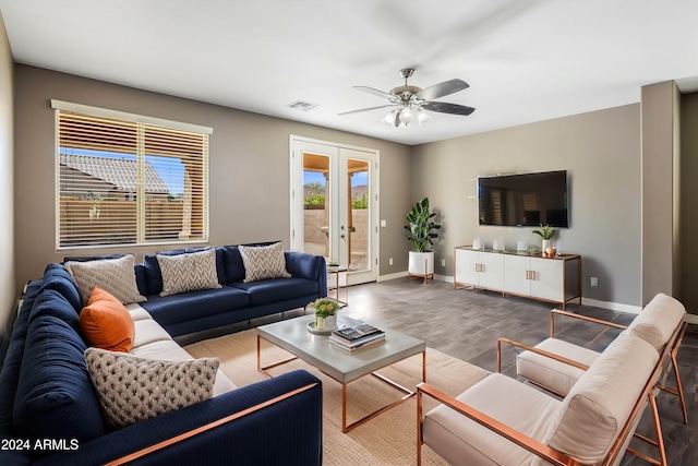 living room featuring visible vents, ceiling fan, baseboards, french doors, and wood finished floors