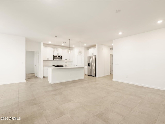 unfurnished living room featuring sink