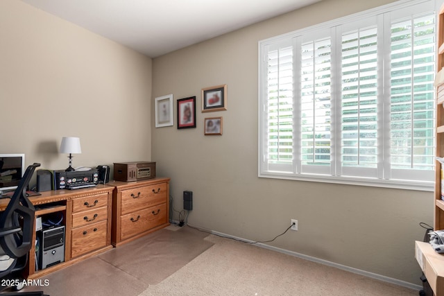 carpeted office with baseboards