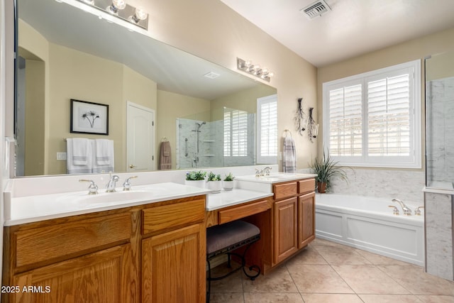 bathroom featuring visible vents, a stall shower, a sink, tile patterned flooring, and a garden tub