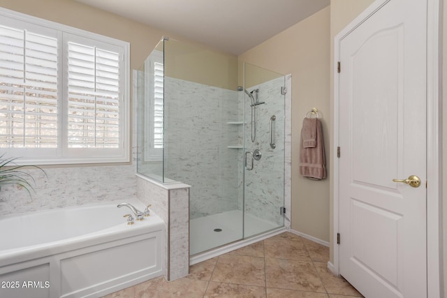 bathroom with a bath, tile patterned floors, and a stall shower