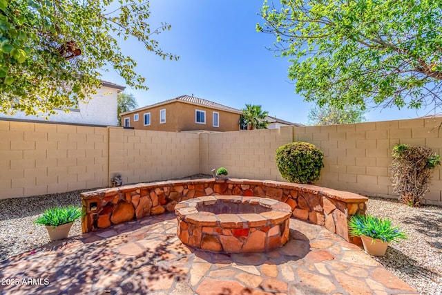 view of patio featuring a fire pit and a fenced backyard