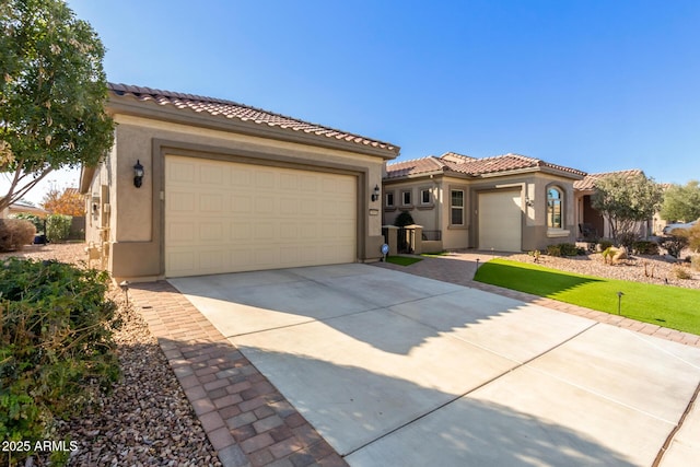 mediterranean / spanish house featuring a garage