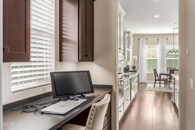 home office featuring hardwood / wood-style floors