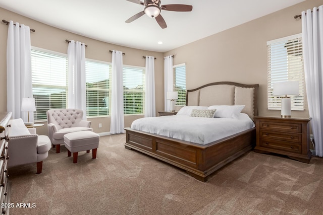 carpeted bedroom featuring ceiling fan