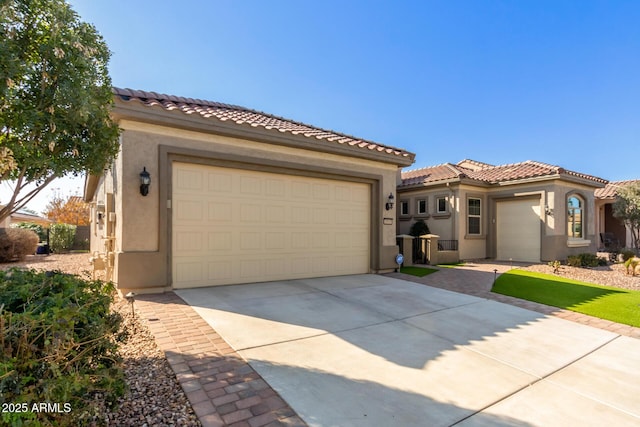 mediterranean / spanish house featuring a garage